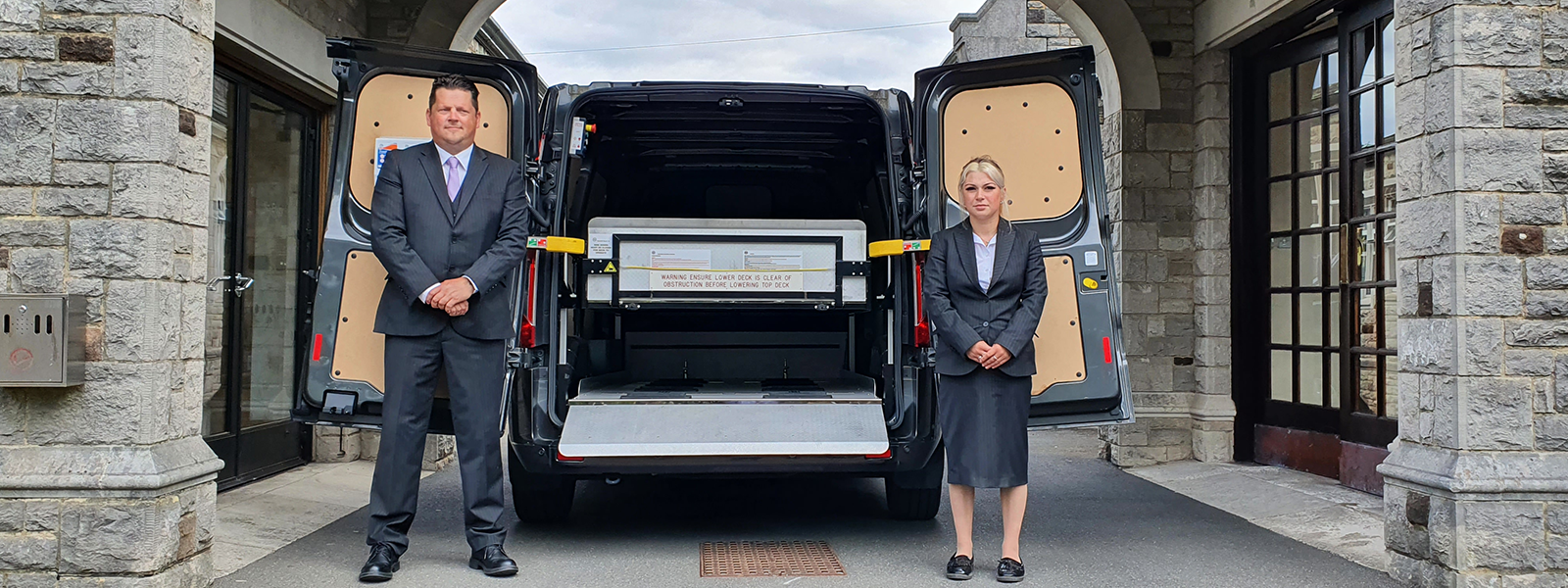 Staff in front of the conveyancing vehicle