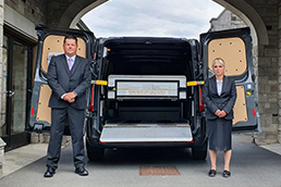 Staff in front of the conveyancing vehicle